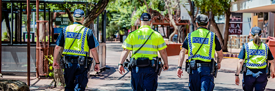 4 police officers in uniform walking the Todd Mall in Alice Springs NT